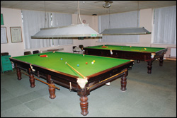 Photograph of the social club snooker room and its 2 snooker tables.